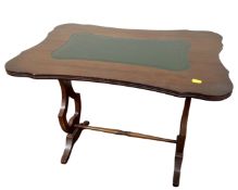 A shaped mahogany occasional table with a green leather inset panel.