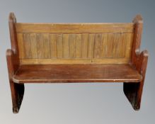 A pitch pine church pew.