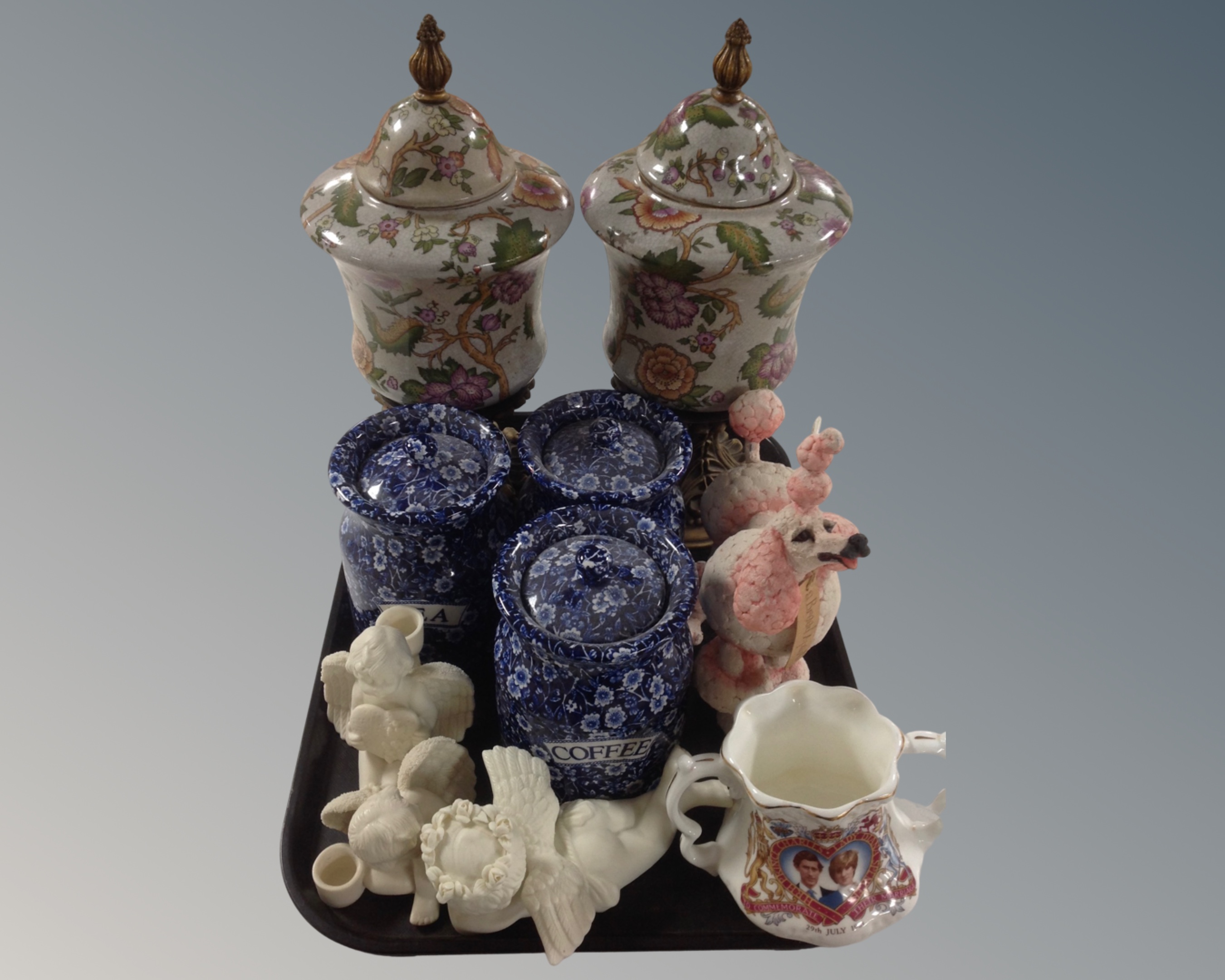 A tray containing a pair of crackle glazed earthenware vases,