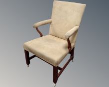 A 19th century mahogany armchair upholstered in a suede style fabric.