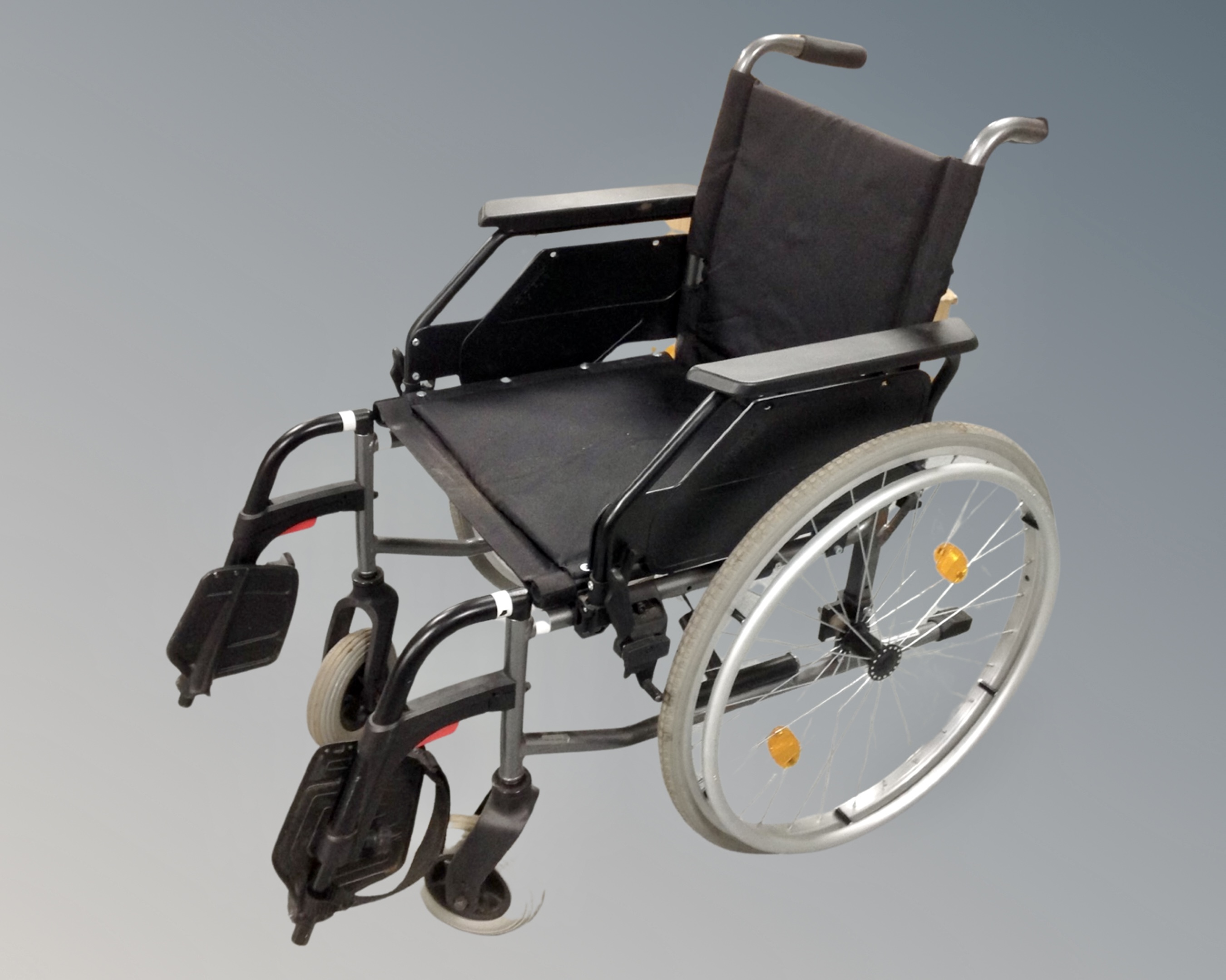 A Dietz folding lightweight wheelchair with footrests