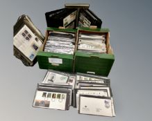 Two stamp album display stands with albums containing first day covers together with two further