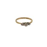 An 18ct gold three stone diamond ring, size O CONDITION REPORT: 1.