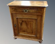 An antique walnut cabinet fitted with a drawer above.
