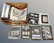 A box containing a quantity of stamp albums.