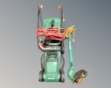 A Qualcast electric lawnmower with lead and box together with a Black & Decker Reflex strimmer.