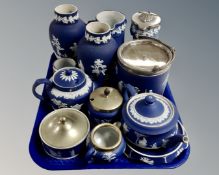A tray of Wedgwood and Tunstall blue and white Jasperware including biscuit barrel, teapots,