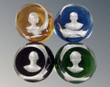 A set of four Baccarat cameo glass paperweights depicting the royal family.