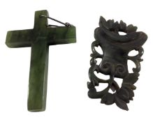 A jade cross together with a carved jade pendant.