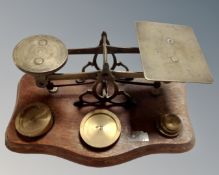 A set of antique brass postal scales.