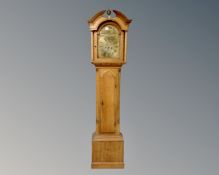 A 19th century inlaid oak longcase clock with brass dial, no pendulum or weights.