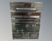 A Kenwood four piece stack system with remote. CONDITION REPORT: Continental wiring.