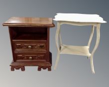 A painted shaped two tier occasional table together with a further painted two drawer bedside stand.