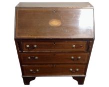 A mahogany marquetry inlaid bureau, fitted with three drawers.