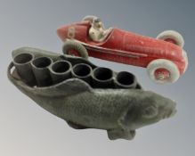 A vintage Dinky Toys Alfa Romeo die cast racing car together with a cast metal miniature stand in