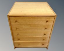 A mid-20th century square five drawer chest.