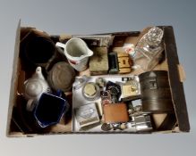 A box containing a decanter with silver collar, hip flasks, whiskey jugs, vintage tins etc.