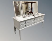 A Stag Minstrel painted six drawer dressing table with triple mirror together with a wine table.