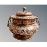 An antique copper twin handled lidded pot.