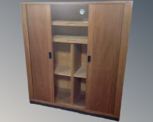 A mid-20th century Scandinavian Nipu double shutter door cabinet fitted with internal shelves.