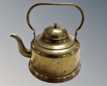 An antique brass kettle.
