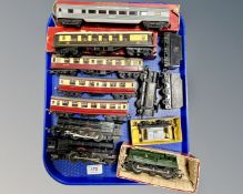 A tray containing boxed and unboxed Tri-Ang die cast locomotives and carriages.