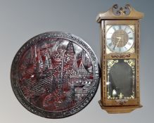 A President 31 day wall clock together with a circular Chinese relief plaque.