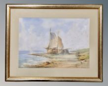K. Baker (20th century) : Fishing boats moored on a beach, watercolour, 44cm by 31cm.