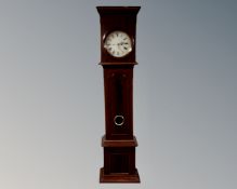 A 19th century mahogany longcase clock with painted dial, pendulum and weights.