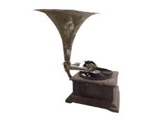 An antique Swiss made table gramophone with horn.