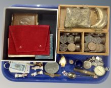 A tray containing a pewter snuff box, a pocket watch, a coin bracelet, two eastern brass purses.
