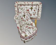 A 20th century button back bedroom chair upholstered in a floral fabric together with a matching 3'