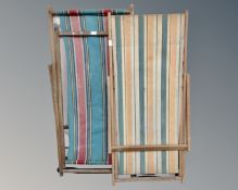 Two vintage folding deck chairs.