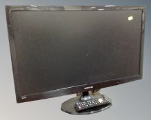 A Samsung Syncmaster T27B300 HD TV monitor with remote.