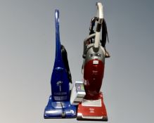 A Miele vacuum cleaner and a The Boss vacuum cleaner.