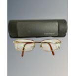 A pair of Cartier spectacles in original box.