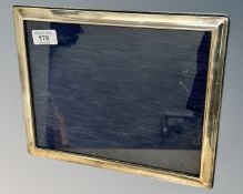 A sterling silver photograph frame, 29cm by 24cm, frame width 1.8cm.
