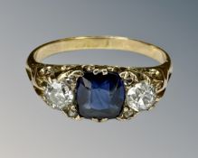An antique sapphire and two stone diamond ring on yellow gold shank, size L.