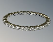 A platinum diamond full eternity ring, size J. CONDITION REPORT: Band depth 1.5 mm.