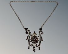 A good quality antique garnet necklace on yellow gold chain.