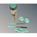 A six piece silver and green enamel dressing/manicure set.