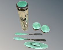 A six piece silver and green enamel dressing/manicure set.