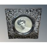 An antique silver photograph frame, Birmingham 1901 marks, 10cm by 10cm.