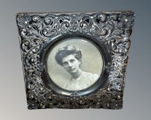An antique silver photograph frame, Birmingham 1901 marks, 10cm by 10cm.