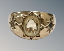 A 9ct yellow gold ring set with a central synthetic stone, size M, 5.3g.