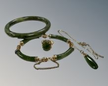A 9ct yellow gold cabochon dark green jade ring, size N, together with jade bangle,