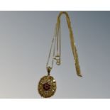 A 9ct yellow gold pendant set with coloured stones mounted on chain, 3.1g, length 45 cm.