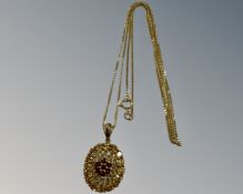 A 9ct yellow gold pendant set with coloured stones mounted on chain, 3.1g, length 45 cm.