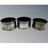 Three antique silver napkin rings.