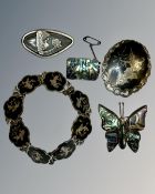 A collection of silver, niello and mother of pearl jewellery.